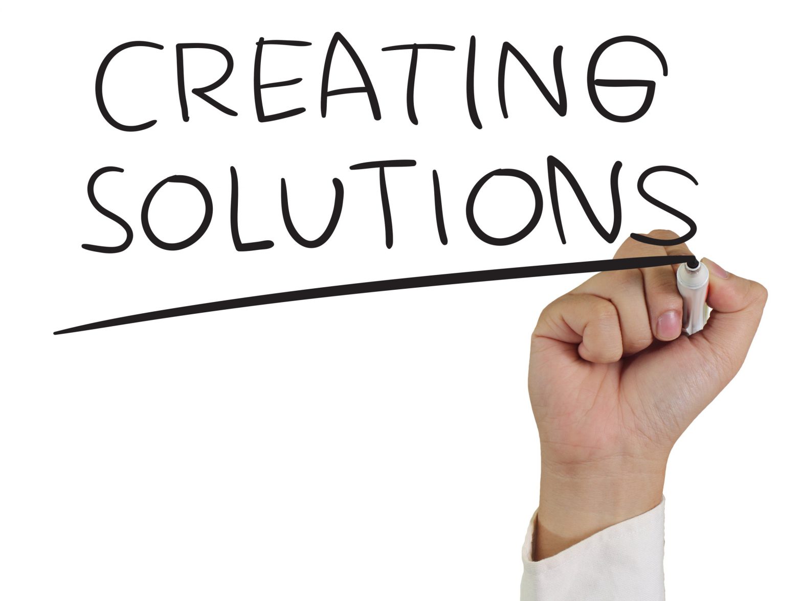 Photo of a hand drawing "creating solutions" in the image